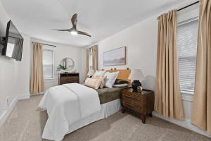 a bedroom with a bed and a ceiling fan at Charming Retreat in Cleveland in Cleveland