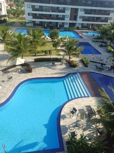 an overhead view of a swimming pool in a resort at Cupe Beach Living Concept 304E in Porto De Galinhas