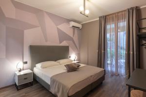 Voodi või voodid majutusasutuse The Time -Home & Hotel- toas