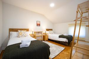 a bedroom with two beds and a ladder at Tierra de Anarbel in Acebal +82 photos