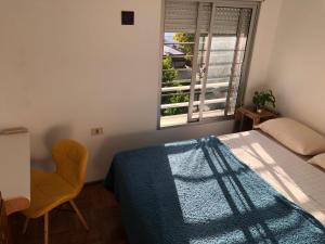 Ein Bett oder Betten in einem Zimmer der Unterkunft Habitación privada en casa compartida - Barrio Sur