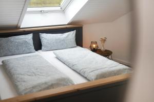A bed or beds in a room at Dasensteinblick