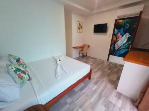 TV a/nebo společenská místnost v ubytování CiNta Hotel