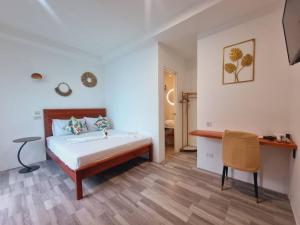 Postel nebo postele na pokoji v ubytování CiNta Hotel