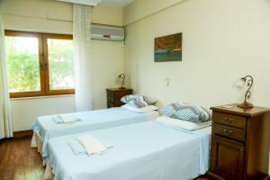 Ένα ή περισσότερα κρεβάτια σε δωμάτιο στο Villa Minta +39 φωτογραφίες