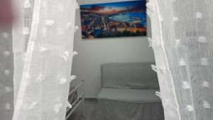 Postel nebo postele na pokoji v ubytování Una Notte a Napoli