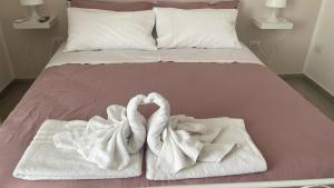 Postel nebo postele na pokoji v ubytování Una Notte a Napoli