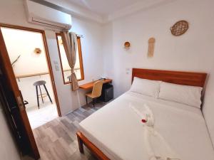 Postel nebo postele na pokoji v ubytování CiNta Hotel
