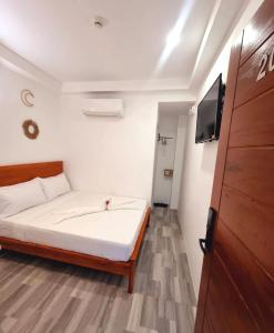 Postel nebo postele na pokoji v ubytování CiNta Hotel