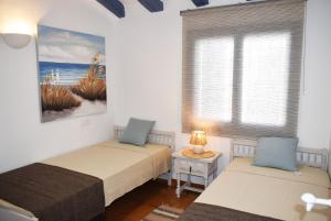 Ένα ή περισσότερα κρεβάτια σε δωμάτιο στο Anacasa Villa Bacalla les Marines CH3400 +27 φωτογραφίες