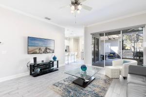 a living room with a couch and a table at W456 - Gleaming Retreat With Private Pool at Reunion in Kissimmee