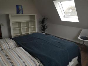 Ένα ή περισσότερα κρεβάτια σε δωμάτιο στο Ferienwohnung Familie Ossenbühl