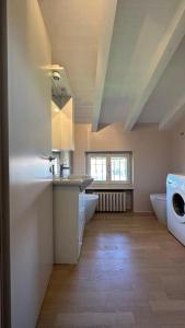 a bathroom with two sinks and a washing machine at Country House Bardolino in Bardolino
