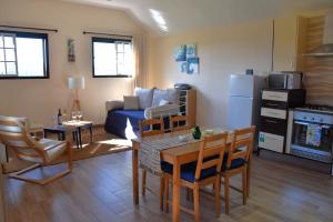 a living room with a couch and a table and chairs at Serenity Views, Silver Coast, PT in Bombarral
