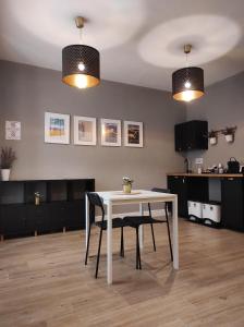TV a/nebo společenská místnost v ubytování Manno Rooms Affittacamere