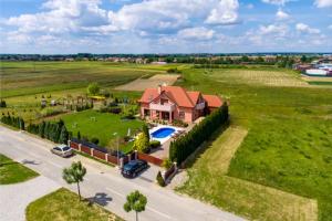 an aerial view of a large house with a yard at 4 bedrooms villa with private pool jacuzzi and enclosed garden at Turcin in Črnec Biškupečki
