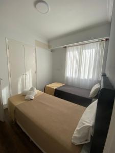 Säng eller sängar i ett rum på Hotel Chacabuco