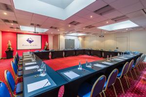 a conference room with a long table and chairs at Hotel Residence Europe & Spa in Clichy +72 photos