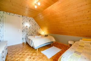 Łóżko lub łóżka w pokoju w obiekcie Gîte en montagne vosges alsaciennes