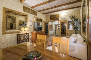 a living room with a couch and a table at Fontana di Trevi Charming Apartment in Rome