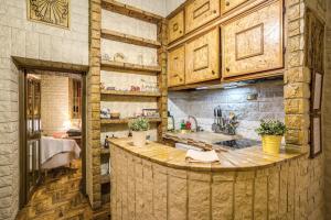 a kitchen with a large island in a room at Fontana di Trevi Charming Apartment in Rome