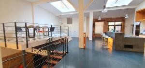 a large room with a kitchen and a dining room at Loft im Szeneviertel Mannheims in Mannheim