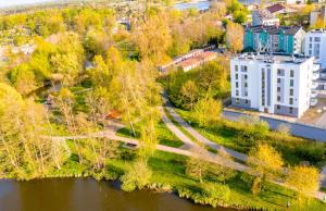 an aerial view of a city with a river and buildings at Bella Vista Apartment in Iława