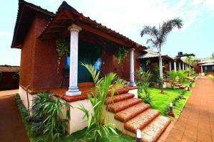 a house with a pathway in front of it at The Four Season Beach Resort - Best Selling Property in Gokarna in Gokarna