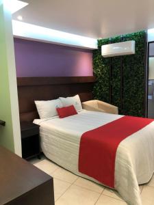 Postel nebo postele na pokoji v ubytování Hotel Imperial