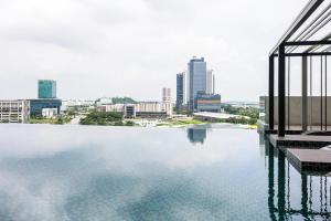 a large body of water with a city in the background at Setia Alam The Forum By GoMain // Next to SCCC in Shah Alam
