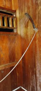 a broom on the wall of a room at Raja Ampat Blue Sea in Besir