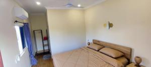 Postel nebo postele na pokoji v ubytování Care Rock Guesthouse