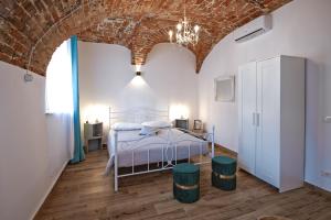 Postel nebo postele na pokoji v ubytování Palazzo Campia