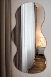 Un pat sau paturi într-o cameră la DaVio Apartments Beige