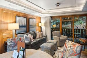 a living room with a couch and chairs at Bridge Street - Unit 202 in Vail