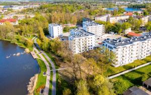 an aerial view of a city with a river and buildings at City View Apartment in Iława