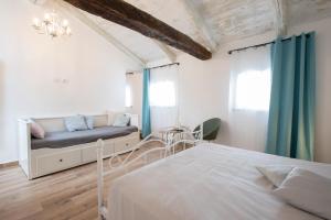 Postel nebo postele na pokoji v ubytování Palazzo Campia