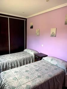 A bed or beds in a room at Villa María.