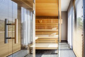 Postel nebo postele na pokoji v ubytování Fürstenfelder Hotel