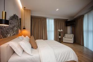 Postel nebo postele na pokoji v ubytování Oro Inn Hotel