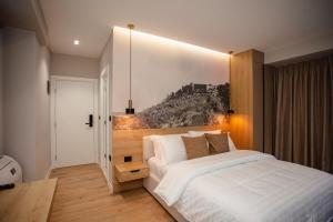 Postel nebo postele na pokoji v ubytování Oro Inn Hotel