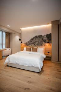 Postel nebo postele na pokoji v ubytování Oro Inn Hotel