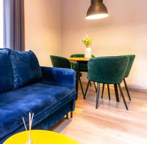 a living room with a couch and a table at Central LOFT in Nowe Miasto Lubawskie