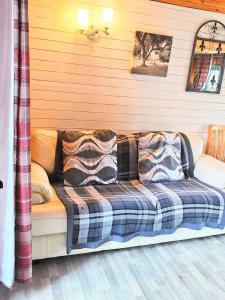 a couch with pillows on it in a room at Otter 1 HuntersMoon-Warminster-Longleat-Wiltshire in Warminster