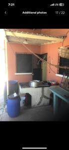 a room with a sink and a pot and a table at Country House in Los Planes. in Panchimalco