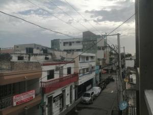 a view of a city street with cars and buildings at apto centro santa marta in Santa Marta
