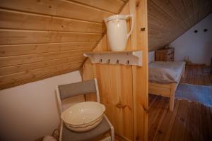 a bathroom with a sink and a toilet in a room at Niezapominajka in Zbiczno +21 photos