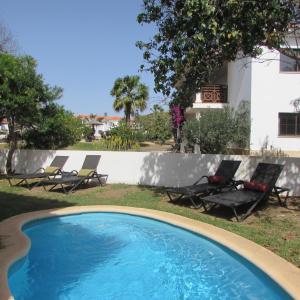 a swimming pool in the yard of a house at Tortuga Beach Resort 3 Bed Villa with pool in Santa Maria