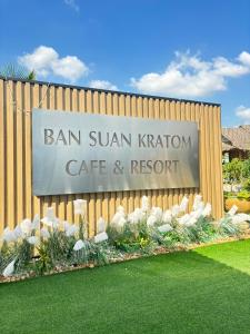 a sign for the san suman kishi cafe and resort at BAN SUAN KRATOM CAFE AND RESORT in Nakhon Pathom