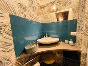 a bathroom with a sink and a mirror at Magica Ortigia in Syracuse